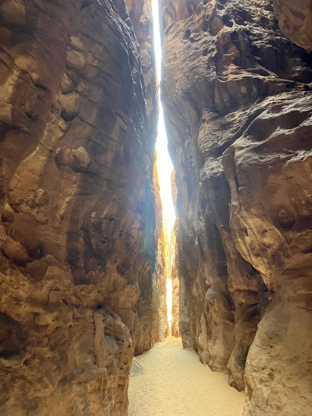 A canyon passage opening into light